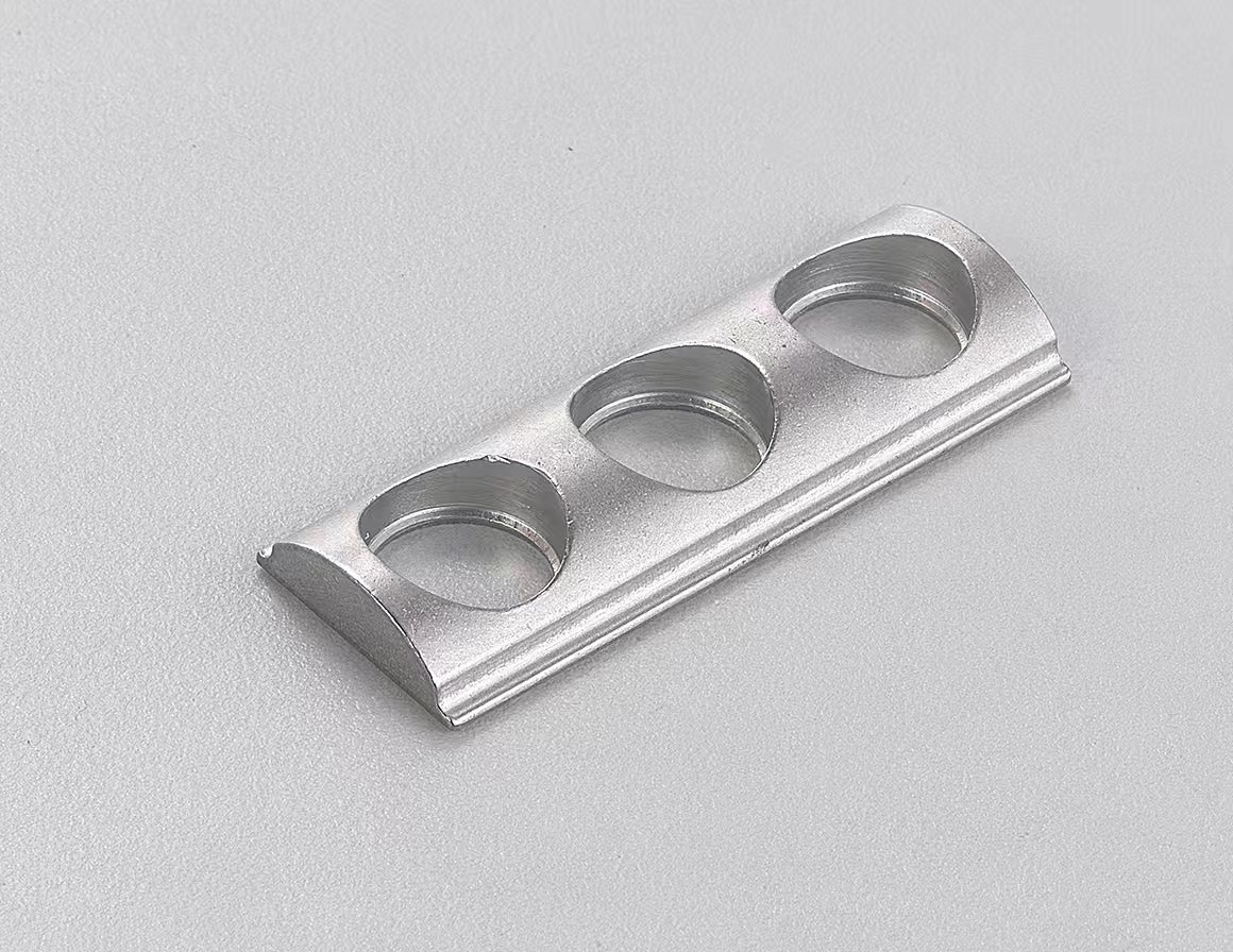Precision multi-hole stamped bracket