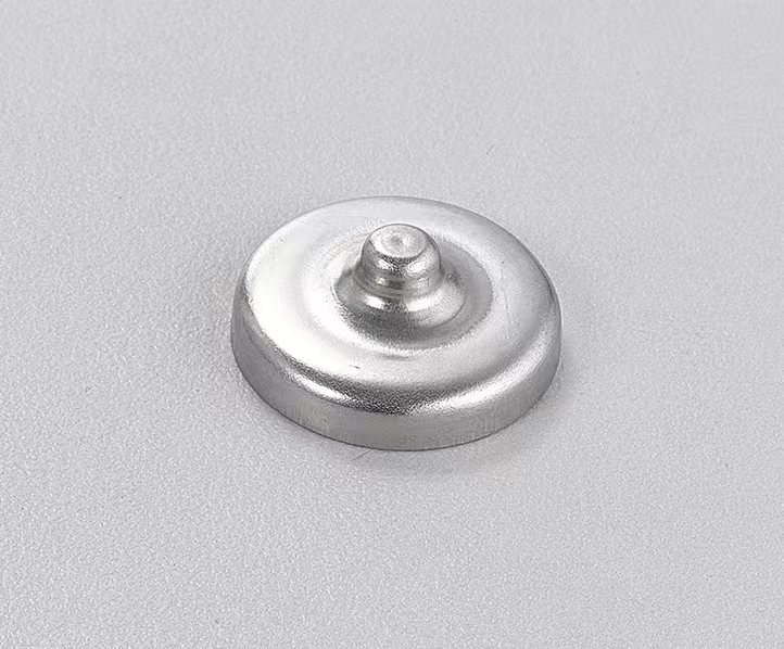 Stamped metal cap